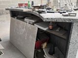 a concrete counter with a bunch of tools on top of it