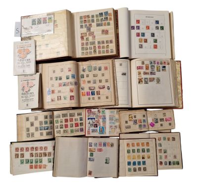 several open books are stacked on top of each other with stamps on them