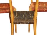 two chairs that are next to each other on a white background