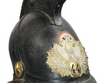 an old helmet with a red pom pom on top of it