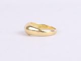 a gold ring on a white background