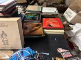 a lot of books on a table with a bag on it