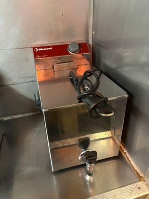 an image of a commercial fryer in a commercial kitchen