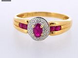 an image of a diamond and ruby ring