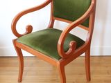 a wooden chair with green upholstered upholstered upholstered upholstered upholstered upholstered upholstered