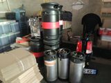 several kegs are stacked on top of each other in a room