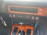 a car dashboard with a gear box and a radio in it
