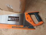a saw that is laying on the floor next to a box