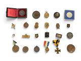 an image of a collection of medals and other items on a white surface