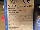 a picture of a blue machine with a sign on it