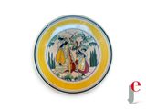 a yellow plate with a picture of a woman and a man on it