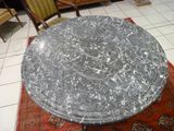 a marble table on a rug in a room