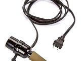 a close up of a cord connected to a plug on a white background