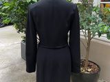 an image of a black suit on a mannequin stand