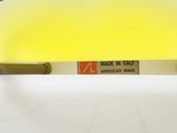 a yellow light that is on top of a white table