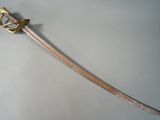 a very long sword that is on display on the table