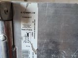 someone is holding a piece of metal in their hand with a price tag attached to it