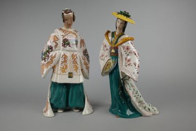 pair of chinese figurines of a woman and a man