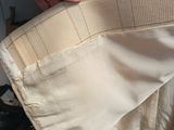 a person that is putting something in the pocket of a jacket