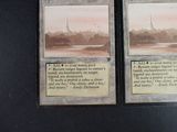 two cards that are sitting on a table