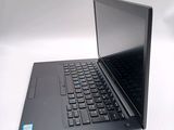 a laptop with a black keyboard on a white surface