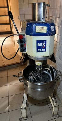 an image of a mixer in a kitchen with tile flooring