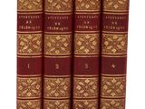 une pile de trois livres rouges posés les uns sur les autres