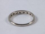 a close up of a silver ring on a white surface