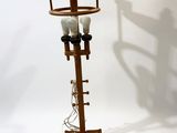 a light that is on top of a wooden stand
