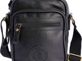 a black leather cross body bag on a white background