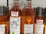 several bottles of wine are lined up on a counter