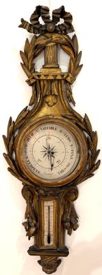 a clock that is hanging on the wall on the wall