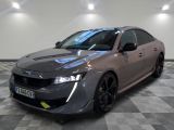 a picture of a grey car in a showroom