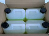 six gallon jugs of water in a cardboard box with lids