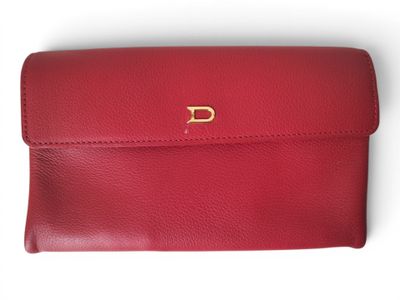 a red leather purse with a gold d on the front