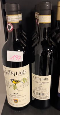 three bottles of wine are on a shelf in a store