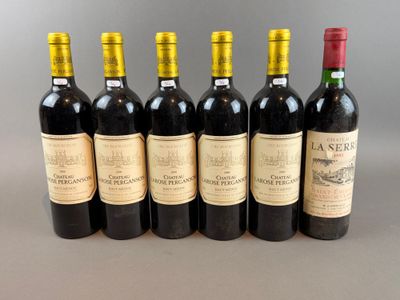 six bottles of wine are lined up in a row on a table
