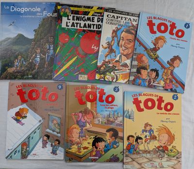 plusieurs livres pour enfants sont alignés sur une surface blanche