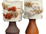 two vases that are decorated with different types of items