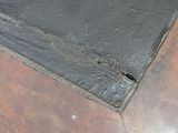 an image of a close up of a wood floor with a hole in it