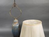 an image of a lamp and a lamp shade on a table