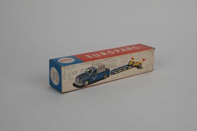 a box with a toy car on it on a white surface