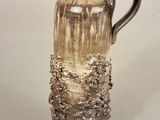 a vase that is sitting on a table with a white background