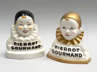 two figurines of people that are standing next to each other