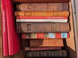 a box full of books sitting on top of a table