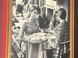 a picture of people sitting at a table in a restaurant
