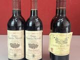 trois bouteilles de vin sont alignées sur un comptoir