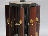 a small wooden box with a bird on top of it