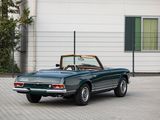 an image of a green convertible car parked in front of a building