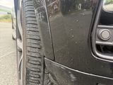 a close up of a car ' s tire on the road